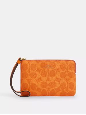 COACH Corner Zip Wristlet In Signature Canvas